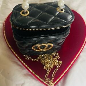 Elegant Black Quilted Bag with Gold Accents